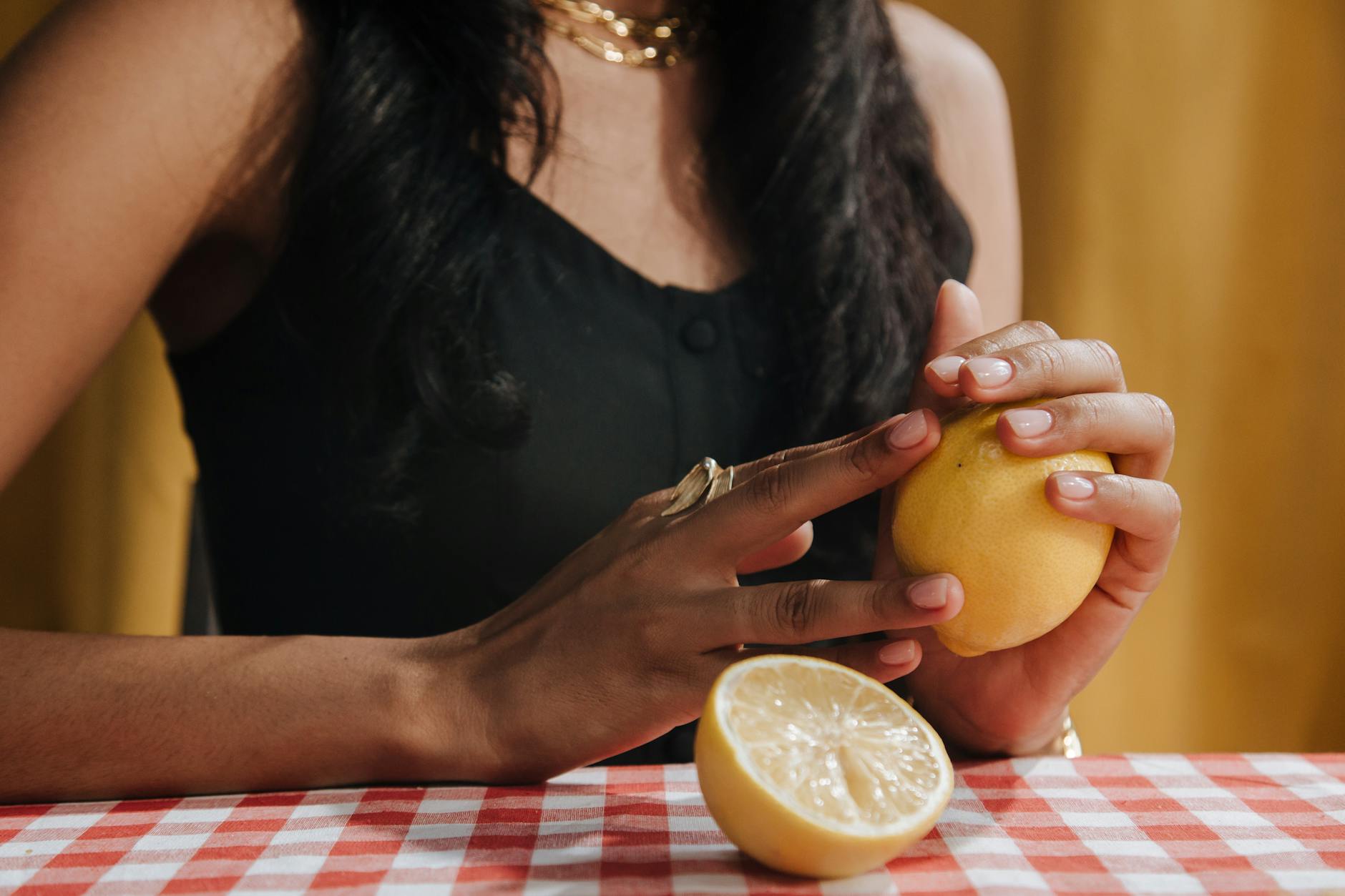 Woman holding fresh lemon symbolizing natural pleasure and arousal after stopping hormonal birth control