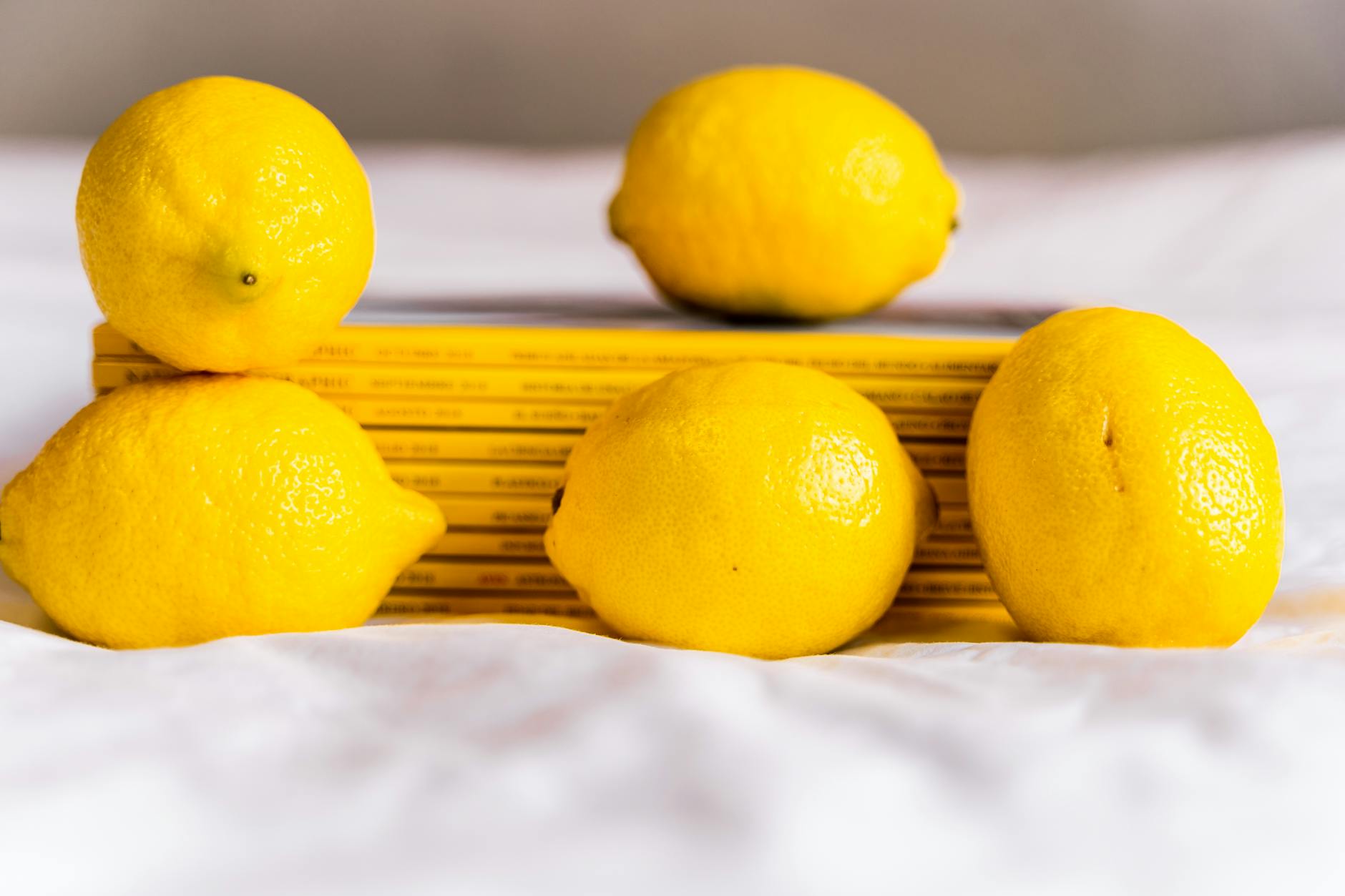 Fresh yellow lemons arranged with books, symbolizing new beginnings and exploration